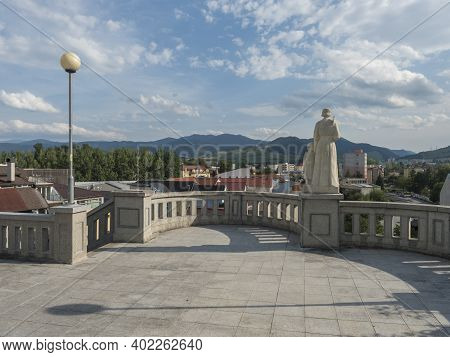 Ruzomberok, Slovakia, August 30, 2020: View Of Ruzomberok Town From City Center With Statue And Gree