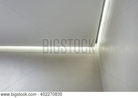 Suspended Ceiling With Halogen Spots Lamps And Drywall Construction In Empty Room In Apartment Or Ho