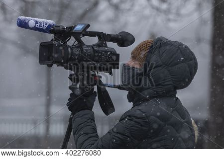 Madrid, Spain - January 07, 2021: A Camera Operator From The Afp Agency, Working In The Buen Retiro 