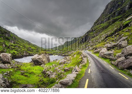 Small Stone Wishing Bridge Over Winding Stream In Green Valley, Gap Of Dunloe In Black Valley, Ring 