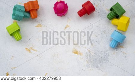 Educational Constructor For Children, Nuts And Bolts In The Form Of Geometric Shapes. Mock Up Backgr