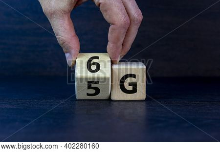 Time To 6g Symbol. Male Hand Turns Wooden Cube And Changes Sign 5g To 6g. Technology, Business, Netw