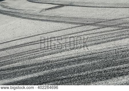 The Rubber Tracks From The Rallye Cars Left On The Tarmac In The Hairpin.