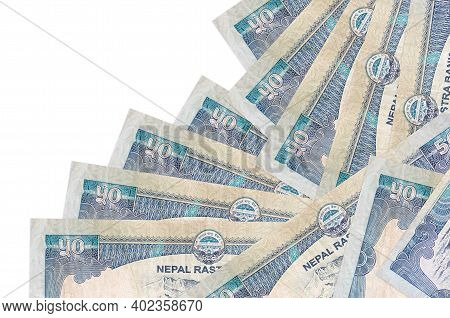 50 Nepalese Rupees Bills Lies In Different Order Isolated On White. Local Banking Or Money Making Co