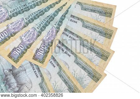 100 Nepalese Rupees Bills Lies Isolated On White Background With Copy Space Stacked In Fan Shape Clo