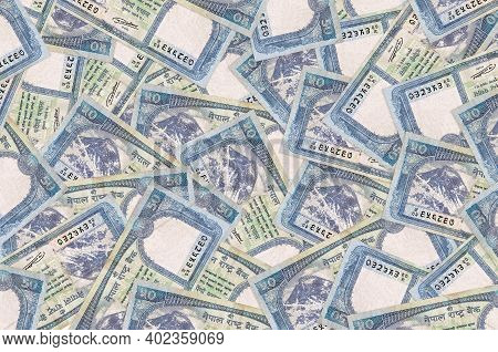 50 Nepalese Rupees Bills Lies In Big Pile. Rich Life Conceptual Background. Big Amount Of Money