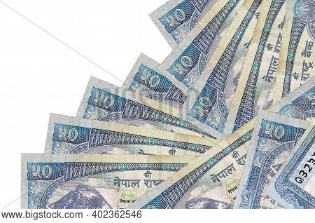 50 Nepalese Rupees Bills Lies In Different Order Isolated On White. Local Banking Or Money Making Co