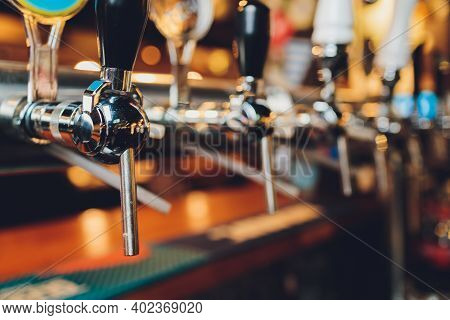The Bar Counter With Bottles And Apparatus For Dispensing Beer. Apparatus For Dispensing Beer At The