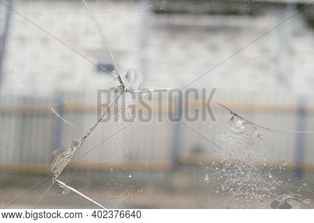 Cracked Glass With Chips Caused By Shrinkage Of Building Structures