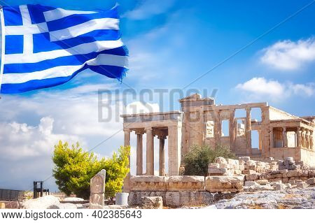 Parthenon Temple On Acropolis And The Greek Flag.