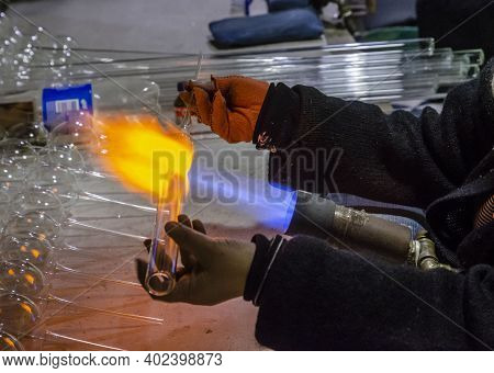 Glassblower Blows Glass Balls From Glass Tubes Burner With High Temperature Propane Flame Close-up G