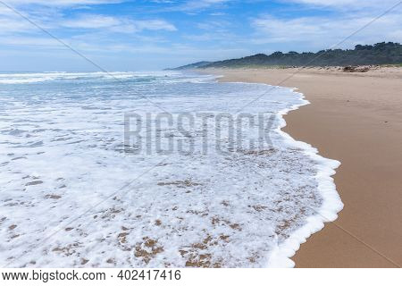 Scenic Empty Beach Ocean Sea Wave Foam Wash Closeup Walking Perspective Along Sand Shoreline Coastli