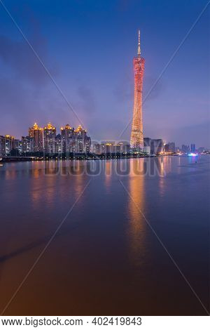 Guangzhou, China skyline on the Pearl River at dusk.