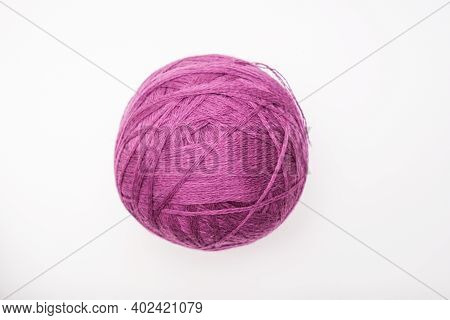 A Ball Of Purple Wool For Knitting, Crocheting Isolated On White, Violet Woolen Thread For Hobby And