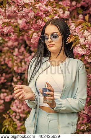 Aroma Compounds. Luxury Fragrance. Fashionable Woman Hold Perfume Bottle. Cherry Blossom Aroma. Fema