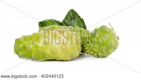 Noni Or Morinda Citrifolia Fruits With Sliced And Green Leaf Isolated On White Background