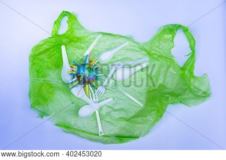 Plastic Products, Such As Plastic Bags, White And Clear Plastic Spoons, Were Placed On White Backgro