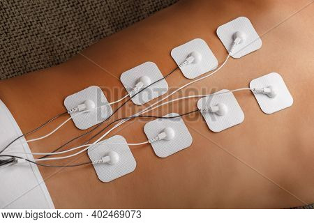 Myostimulation Procedure On The Back In A Beauty Salon.