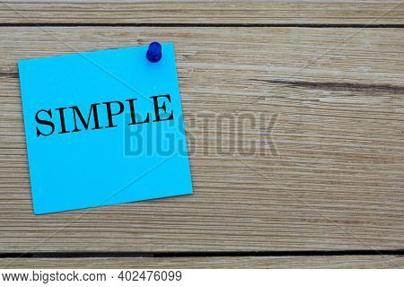 Simple Is An Acronym Written On A Blue Sheet Attached To A Wooden Board. Busines Concept. Keep It Si
