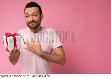 Handsome Positive Pleased Brunet Young Unshaven Man Isolated Over Pink Background Wall Wearing Pink 