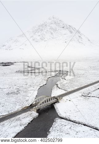 Buachaille Etive Mor Covered In Snow During Winter Aerial View