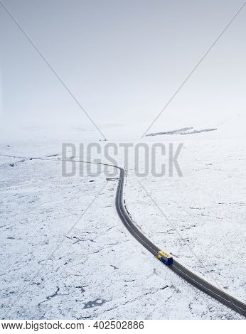 Aerial View Of A82 Road Through Rannoch Moor And Black Mount Covered In Snow During Winter