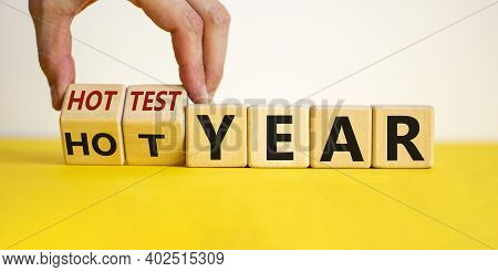 Hottest Year And Global Warming Concept. Hand Turns Cubes And Changes Words 'hot Year' To 'hottest Y