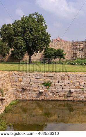 Hampi, Karnataka, India - November 5, 2013: Zanana Enclosure. Corner Of Borwn Stone Queens Pool Or T
