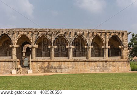 Hampi, Karnataka, India - November 5, 2013: Zanana Enclosure. Low Historic Brown-stone Building Wher