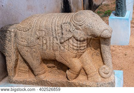 Hampi, Karnataka, India - November 5, 2013: Zanana Enclosure. Gray Stone Elephant Statue On Blue Ped