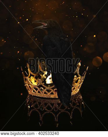 Fantasy World. Black Crow Sitting On Golden Crown, Bokeh Effect