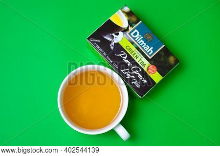 A Cup Of Dilmah Green Leaf Tea On A Green Background. 06.01.2021. Warsaw, Poland