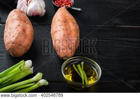 Sweet Potato Or Batat  With Ingredients, On Black Wooden Background With Space For Text.