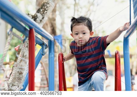 Asian Boy Portrait Tired Expression, Little Boy Playing At The Park On The Playground For Kids & Chi