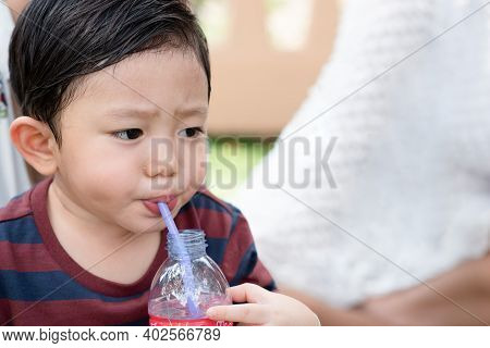 Portrait Of Asian Little Boy While Water Drinking After Playing At The Park On The Playground For Ki