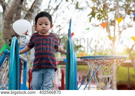 Asian Boy Portrait Tired Expression, Little Boy Playing At The Park On The Playground For Kids & Chi