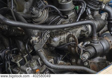 Car Repair, Car Service Concept. Fragment Of  Engine Compartment Of Diesel Truck. Engine, Exhaust Ma