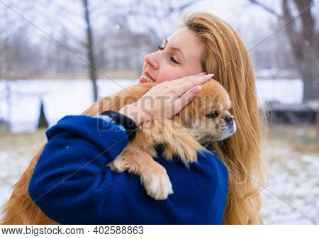 Nice Young Woman On A Walk With Her Dog Resting At Park. Best Friendship Girl And Senior Dog. Psycho