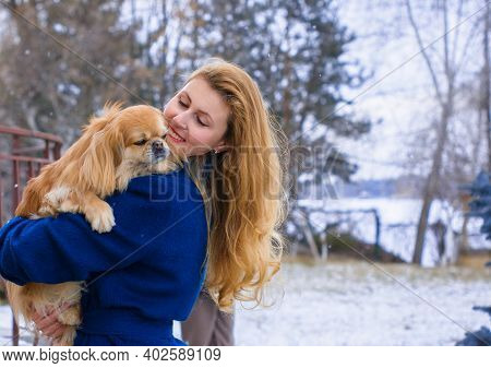 Nice Young Woman On A Walk With Her Dog Resting At Park. Best Friendship Girl And Senior Dog. Psycho