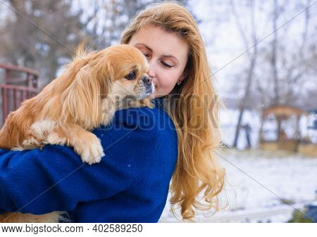Nice Young Woman On A Walk With Her Dog Resting At Park. Best Friendship Girl And Senior Dog. Psycho
