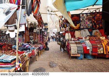 Pisac, Peru - September 04, 2016: Colourful Goods For Sale In Marketplace In Pisac, Peru On Septembe