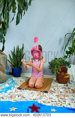 Little Girl Wearing Snorkeling Mask Imitates Swimming In Fictional Beach