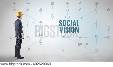 Engineer working on a new social media platform with SOCIAL VISION inscription concept
