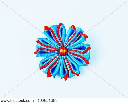 Decoration In The Technique Of Kanzashi. Handmade Work. Flower Made Of Satin Ribbons. Wedding Access