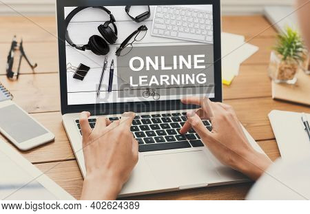 Female Hands Typing On Laptop With Online Learning Inscription On Screen, Cropped. Unrecognizable Wo