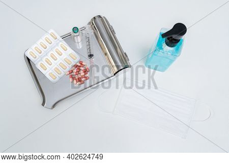 Anti-coronavirus Drugs And Vaccine With Syringe Mask And Alcohol Gel, Medicine And Drug Concept.