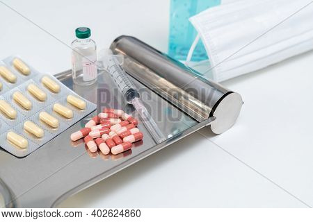 Anti-coronavirus Drugs And Vaccine With Syringe Mask And Alcohol Gel, Medicine And Drug Concept.