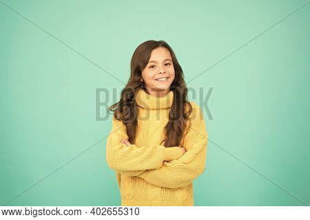 Positive Mood. Kids Psychology. Adorable Smiling Girl Wear Yellow Sweater Turquoise Background. Posi