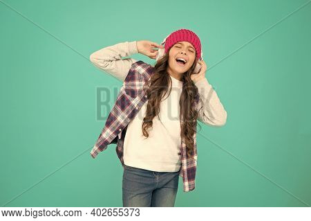 Singing With Mp3 Player. Small Child Long Hair Enjoy Stereo. Happy Childhood. Happy Girl Turquoise B