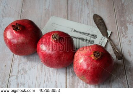 Three Beautiful Red Grenades, Grenades On The Table, Old Knife Next To Grenades, Vintage Knife